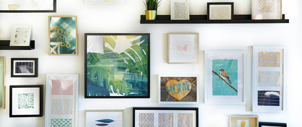 Various picture frames hanging on a wall