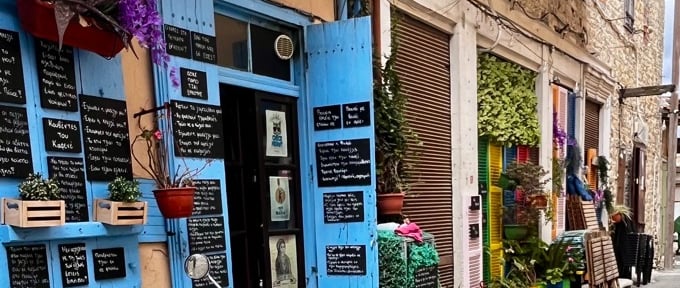a scooter parked in front of a restaurant