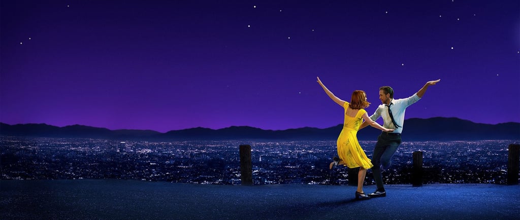 Stone and Gosling dance in silhouette against a city skyline in La La Land (2016)