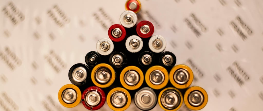 Batteries of various sizes in a triangle formation