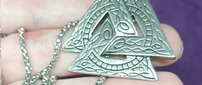 a talisman of Odin's symbol with a necklace