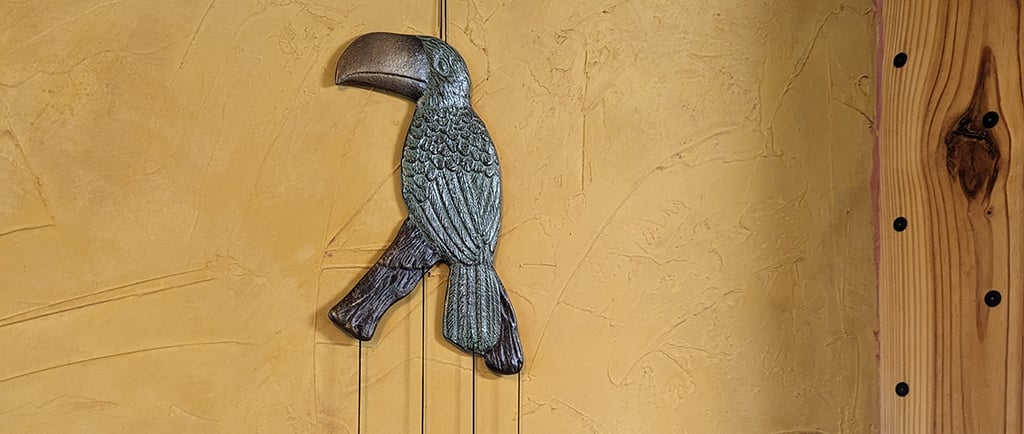 Faux Tuscany stucco wall mural treatment in a kitchen and dining room open concept.