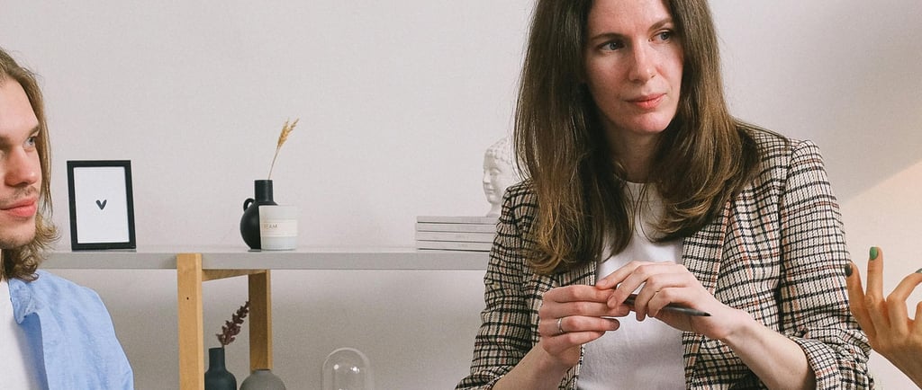 A facilitator and observer sitting in a user interview