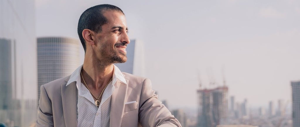 a man in a suit and a watch on a balcony
