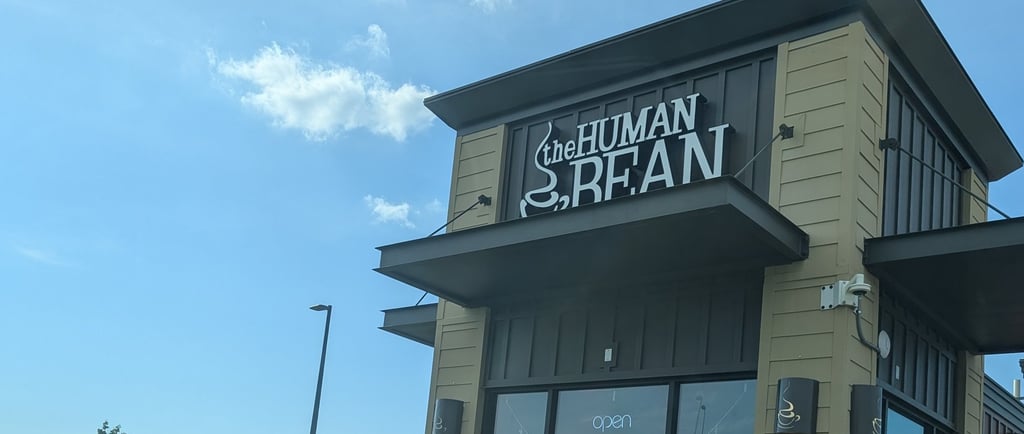 a building showing a coffee shop brand