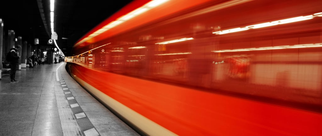 a train is moving along the tracks in a subway
