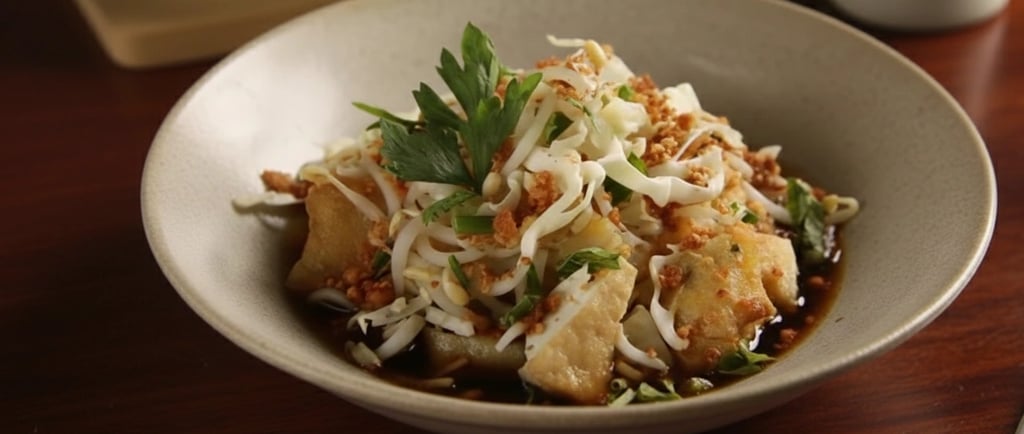 a bowl of food with a fork and a fork