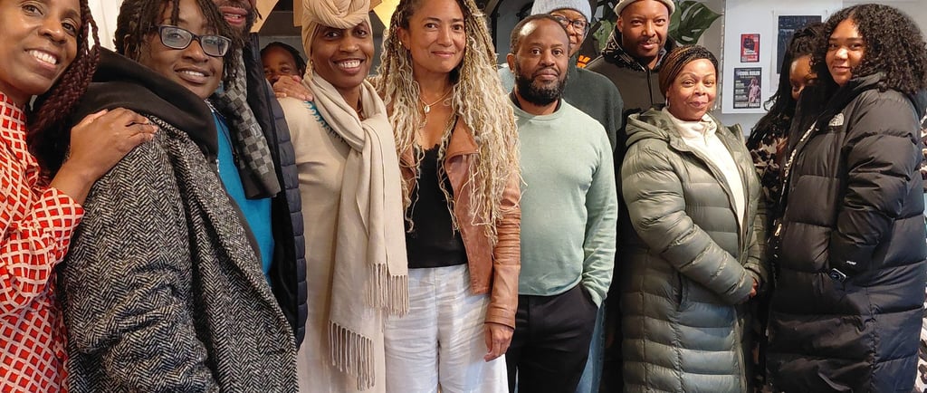 a group of people standing in the Portobello Shack