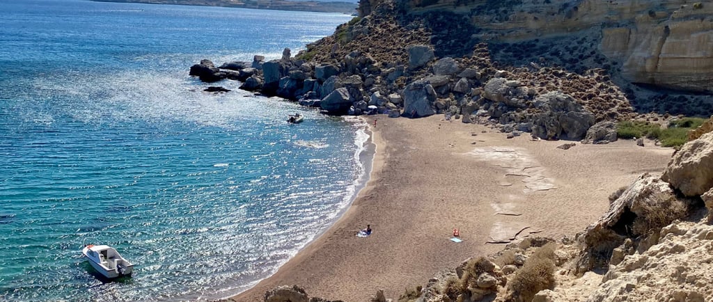 a beach with a boat in the water