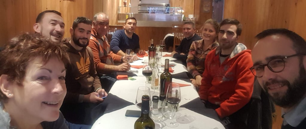 a group of people sitting around a table