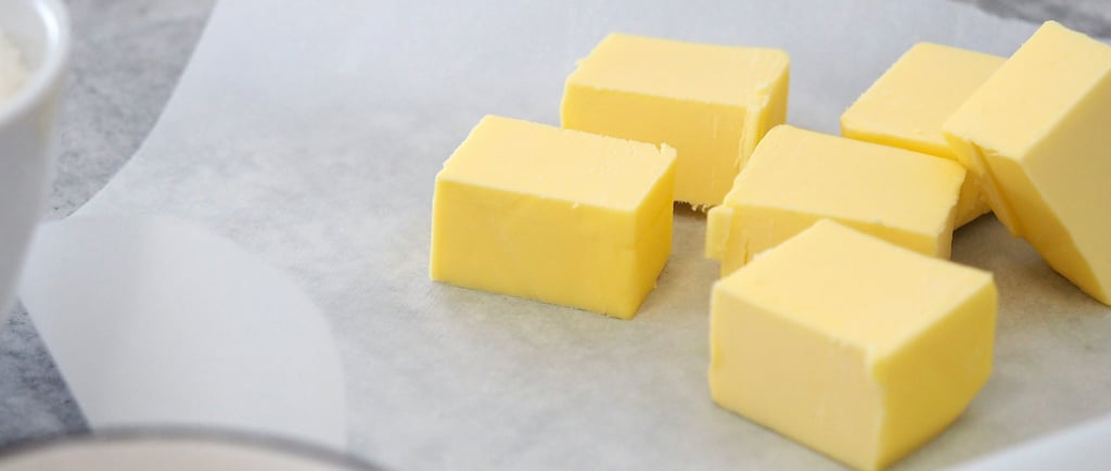 a bunch of butter butter cubes on a table