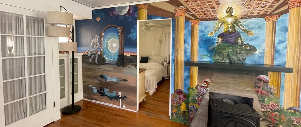 the living room, complete with a fireplace and vibrant wall art