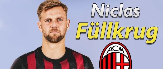 a man in a striped shirt and a soccer ball