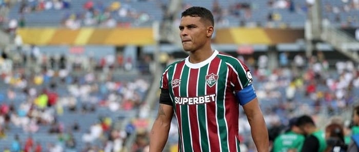 a soccer player is standing in front of a crowd