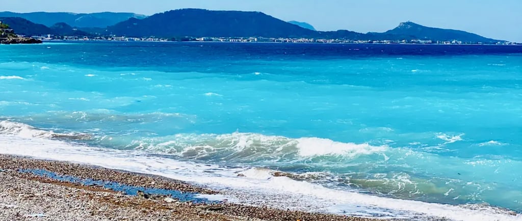 a beach with a surfboard and a surfboard