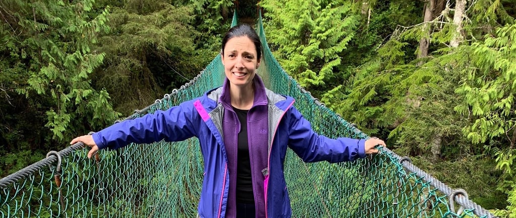 Brava Braun standing on a suspension bridge