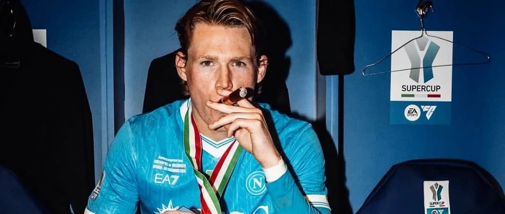 a man sitting in a bench with a trophy