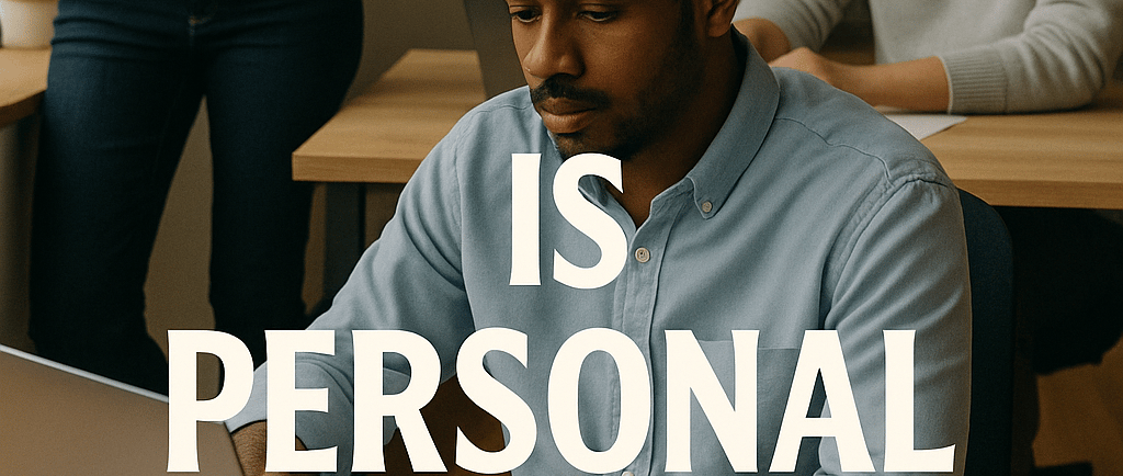 a man and woman sitting at a desk with a laptop