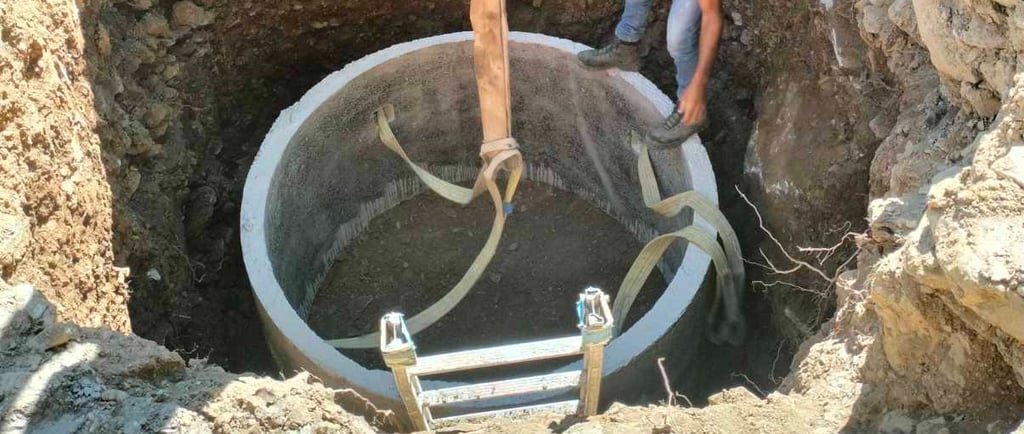 Septic tank installation at a construction site