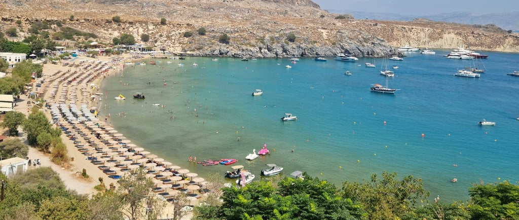 a beach with a view of a beach and a boat
