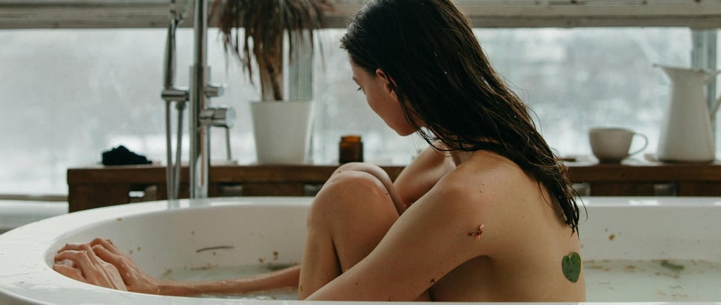 a woman sitting in a bathtub