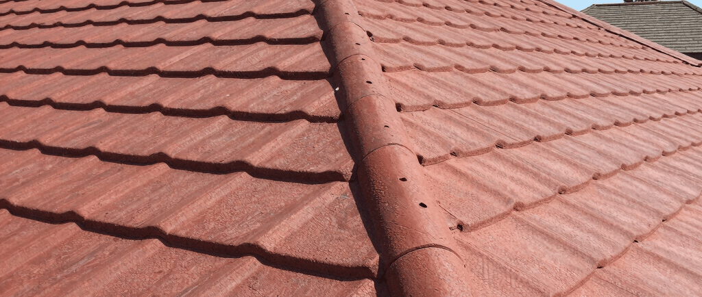 a rusted pole with a sticker on it