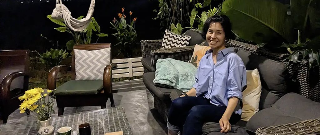 Person sitting at coworking space terrace at night in Hoi An, Vietnam