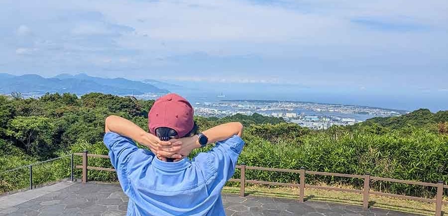 Traveler enjoying panoramic views over Shizuoka, Japan.