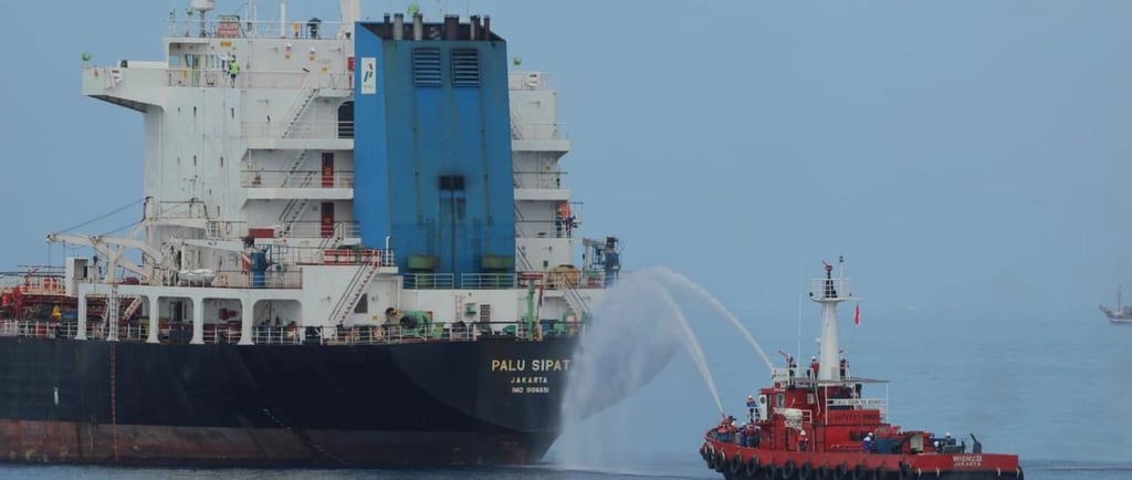 a tug boat with a tuggle in the water