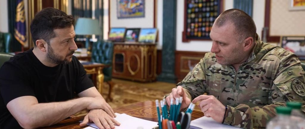 a soldier in uniform sitting at a table