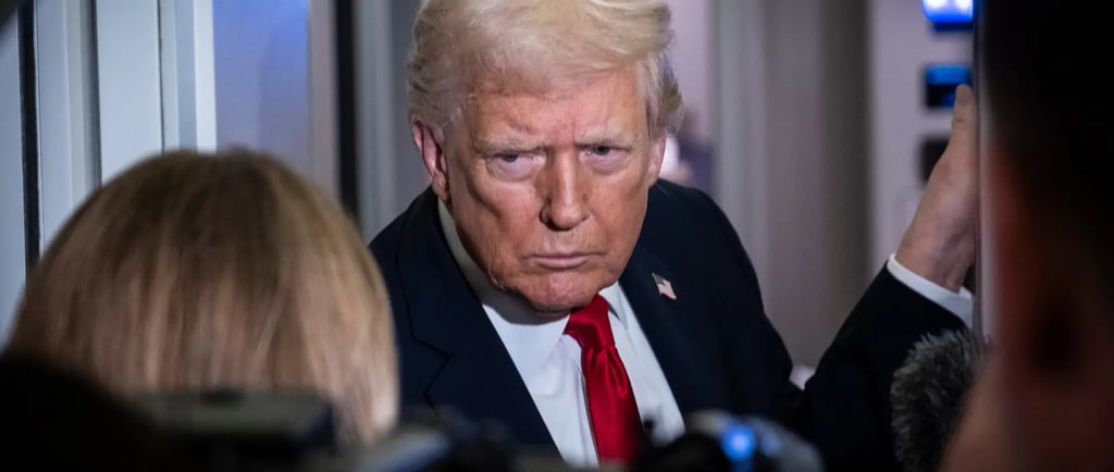 a man in a suit and tie with a camera