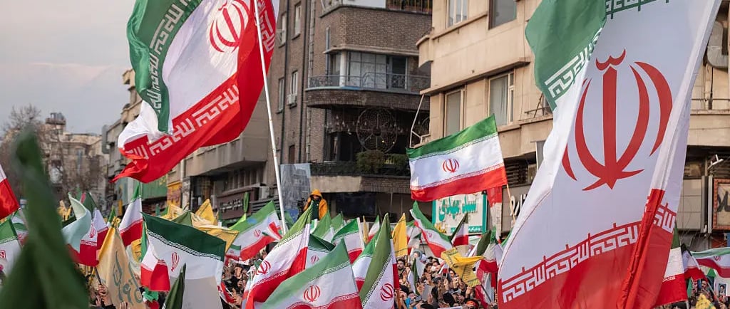 a large group of people standing in front of a building