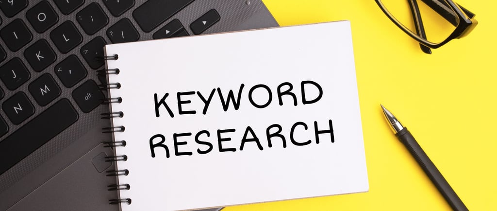 A note pad that has keyword research lines written on it.