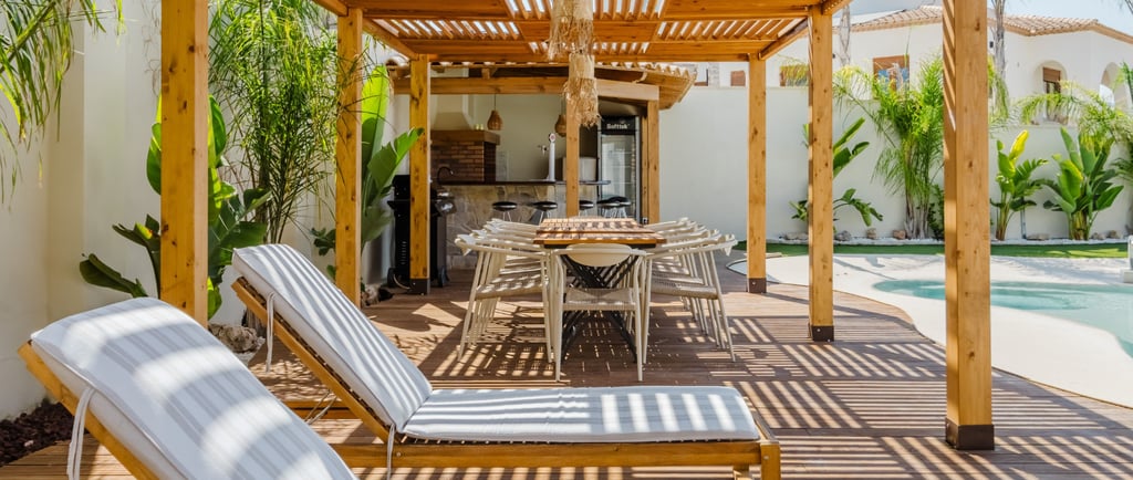 A French Mediterranean terrace table set against a protected edge at the hour it is used.