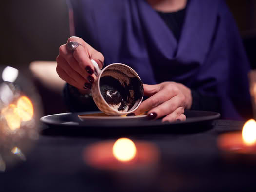 coffee grounds reading fortune telling in a cup
