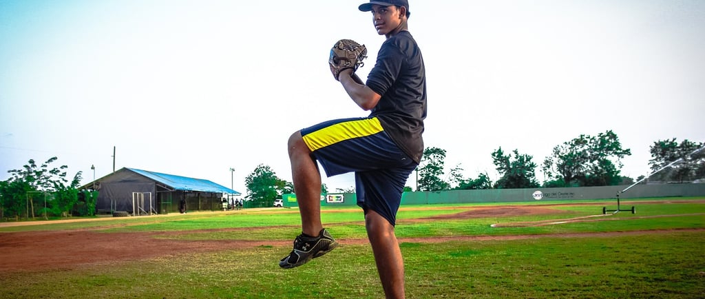 Young Dominican baseball player practicing on a local baseball field in the Dominican Republic
