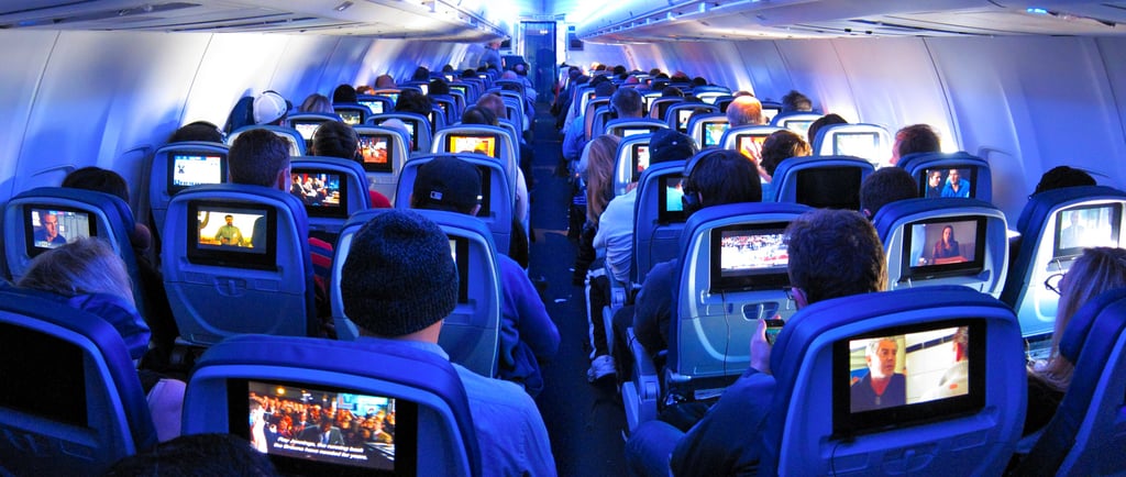a group of passengers sitting in a plane