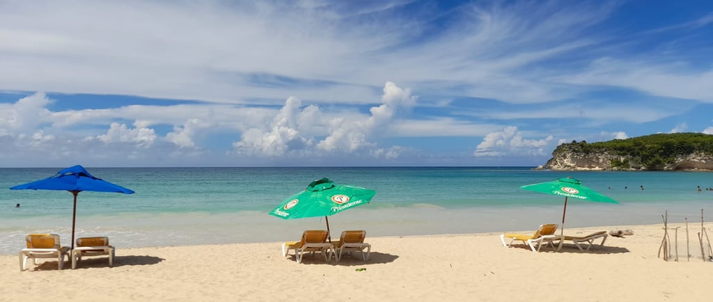 Macao Beach with turquoise water, soft sand, and Presidente umbrellas in the Dominican Republic