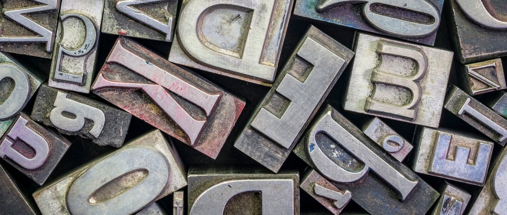 a bunch of old metal letters with different styles of letters