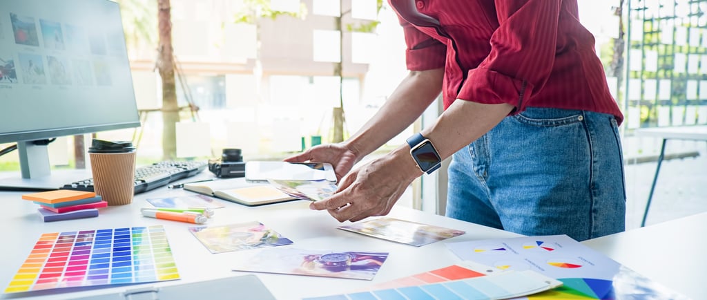 a person standing in front of a computer screen