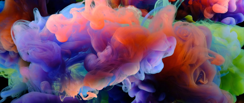 a bunch of colorful colored inks in a black background