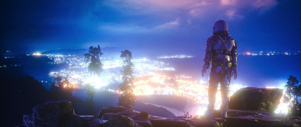 a man in a helmet standing on a rock