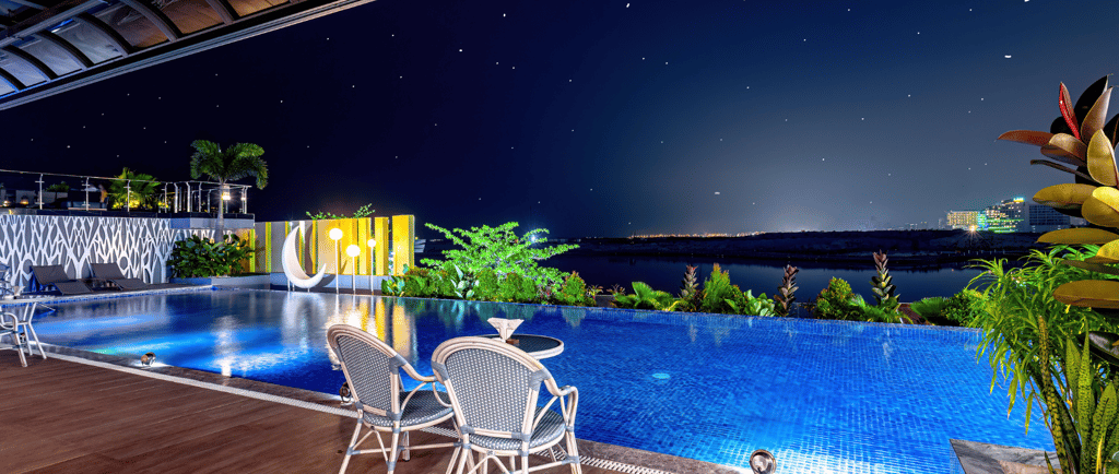 Rooftop infinity pool at Luo City Spa Manila overlooking the city lights and night sky