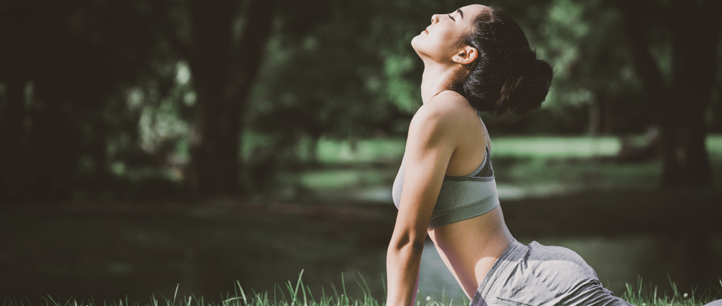 Woman practicing yoga for stress relief and fertility wellness