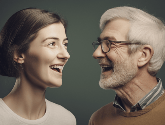 a man and woman smiling at each other