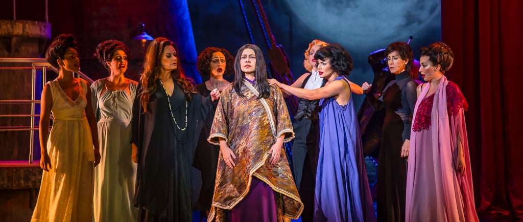 a group of people in costumes on stage