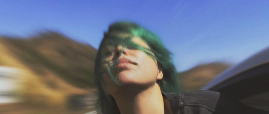 a woman with green hair and green hair