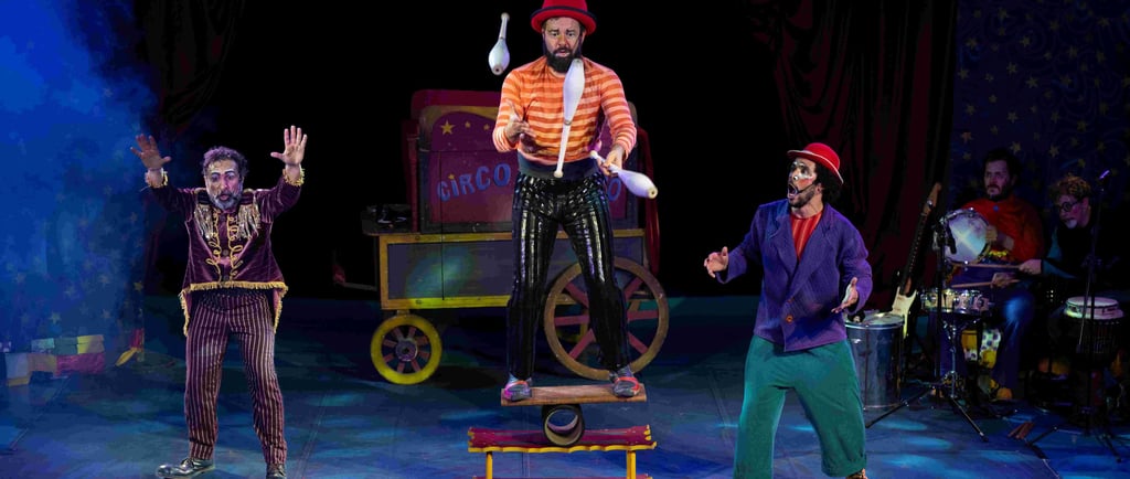 a man in a clown costume standing on a stage