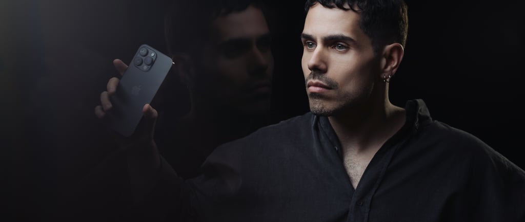 a man holding a cell phone in his hand