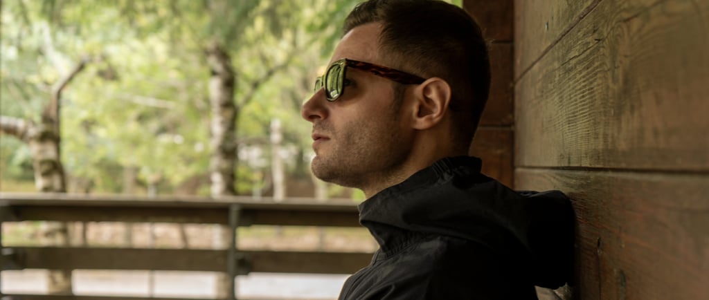 a man in sunglasses and sunglasses is looking at something